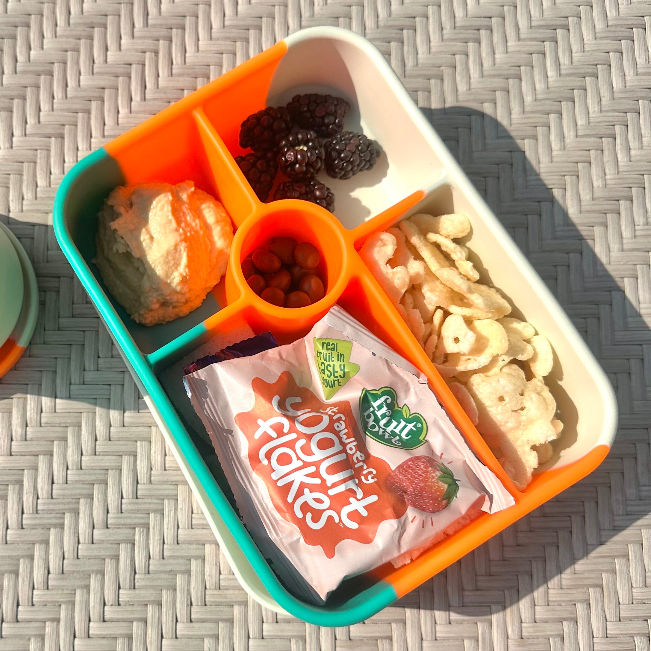 Bumble & Ivy Rio 5 compartment silicone bento box packed with healthy snacks, fruit and treats for kids lunches, school meals and family days out