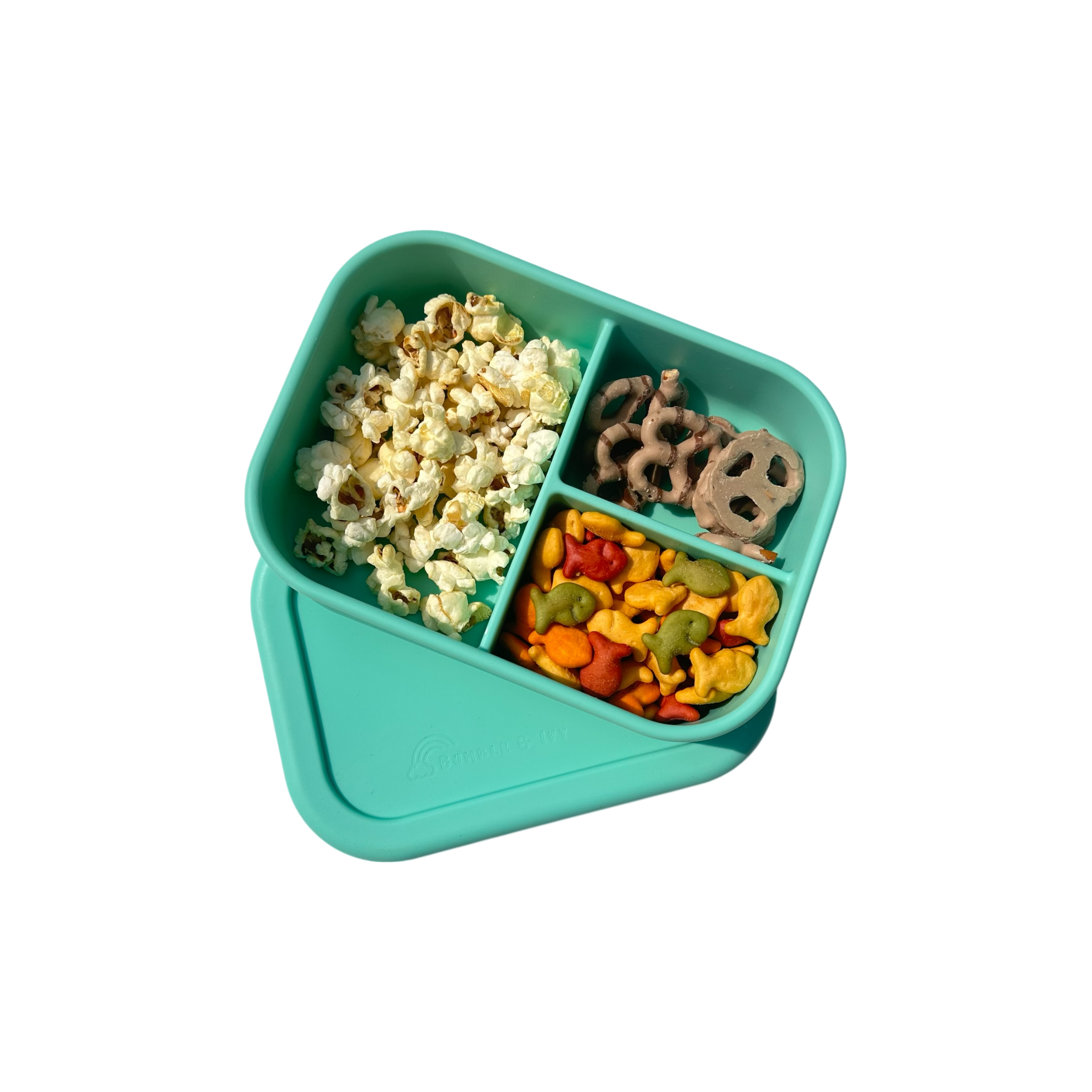 Bumble & Ivy Pearl Aqua design 3-compartment silicone kids bento box filled with healthy snacks.