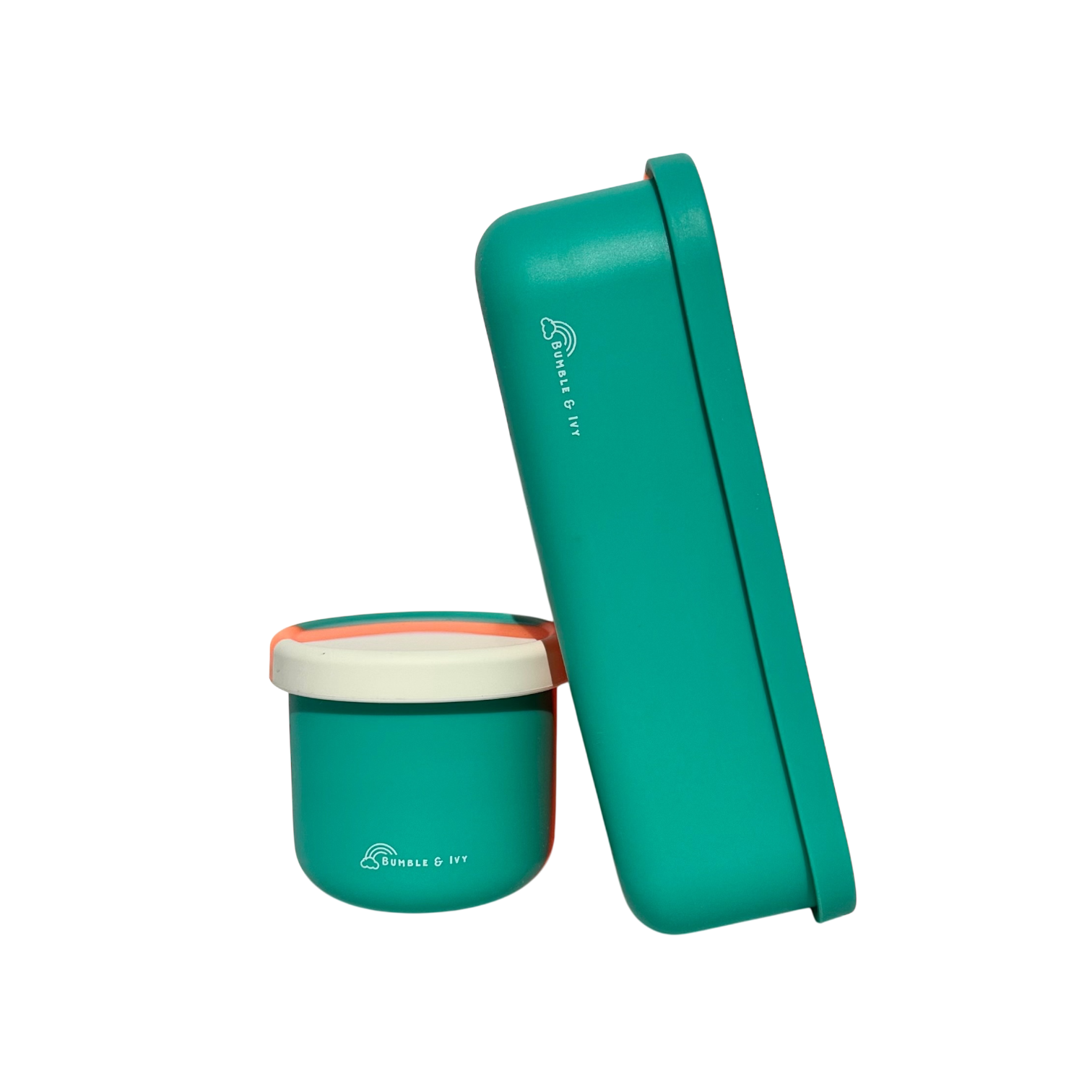 A teal and cream kids silicone bento box and matching round snack pot showing a side profile view with secure lids.