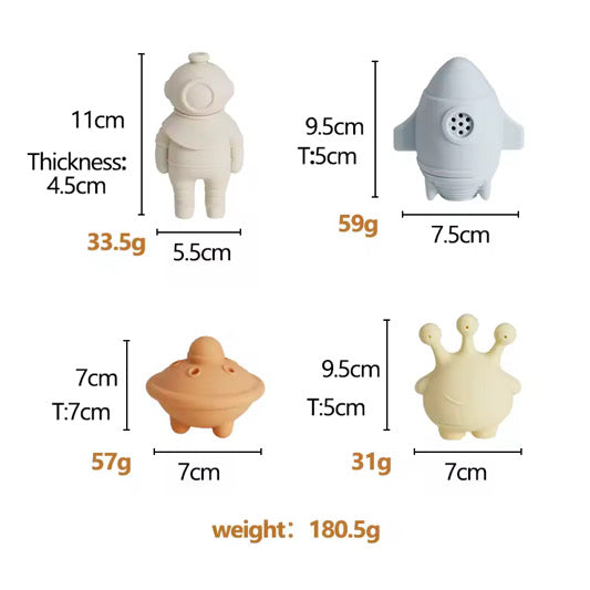 toys. Showcasing individual sizes and weights: Astronaut (11cm x 5.5cm, 33.5g), Rocket (9.5cm x 7.5cm, 59g), UFO (7cm x 7cm, 57g), and Alien (9.5cm x 7cm, 31g). Total weight 180.5g. Lightweight design for toddler hands.