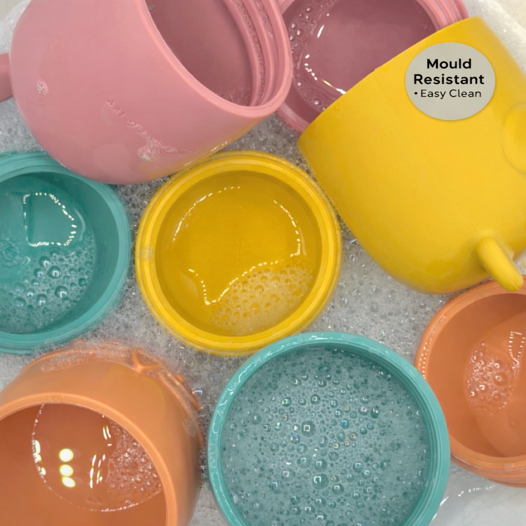 Bumble & Ivy Woodland Bath Toys opened during cleaning to show easy-clean mould-resistant design. Silicone bath toys that twist apart for rinsing and drying, helping reduce trapped water and hidden mould.