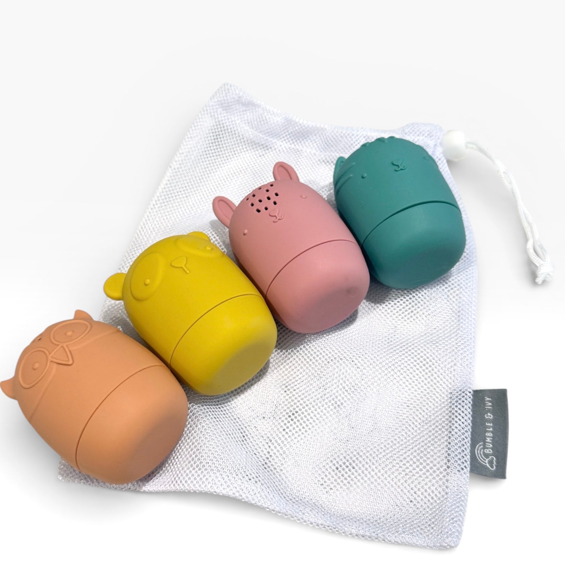 Bumble & Ivy Woodland Bath Toys set featuring bear, owl, fox and bunny characters with free mesh storage bag included. Easy-clean mould-resistant silicone bath toys that twist apart for cleaning and drying.